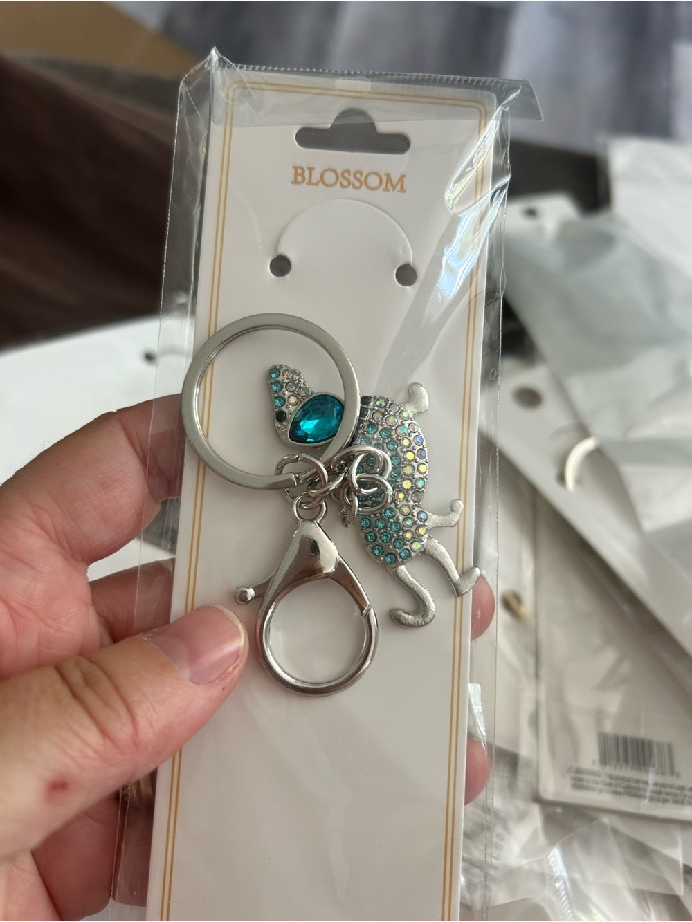 4/$50 Blossom Silver Cat Keychain with Teal Crystals